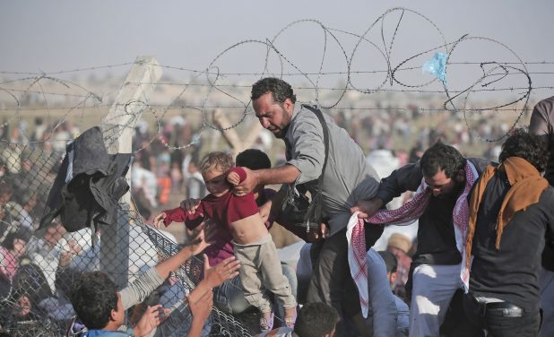 This image has an empty alt attribute; its file name is World-Refugee-Crisis-618x376-1.jpg